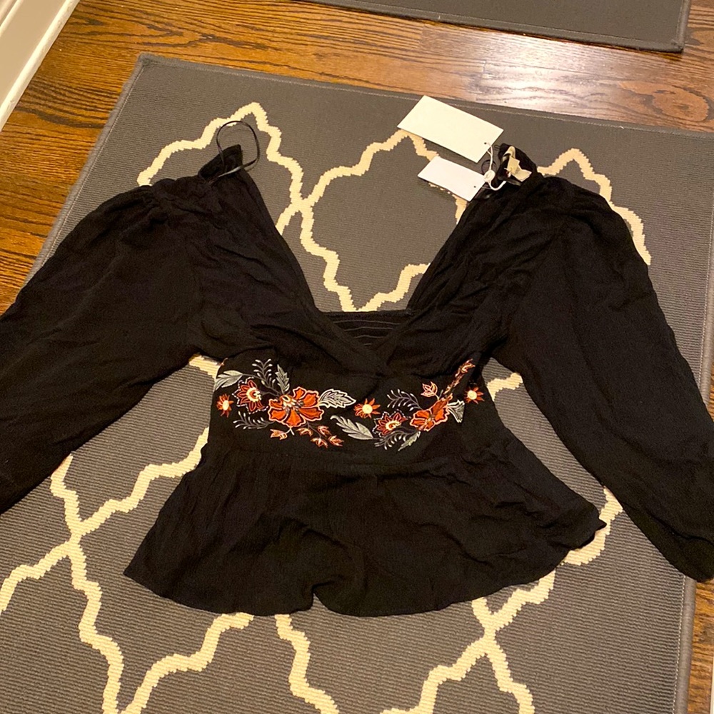 Brand new! Long sleeved crop top.
